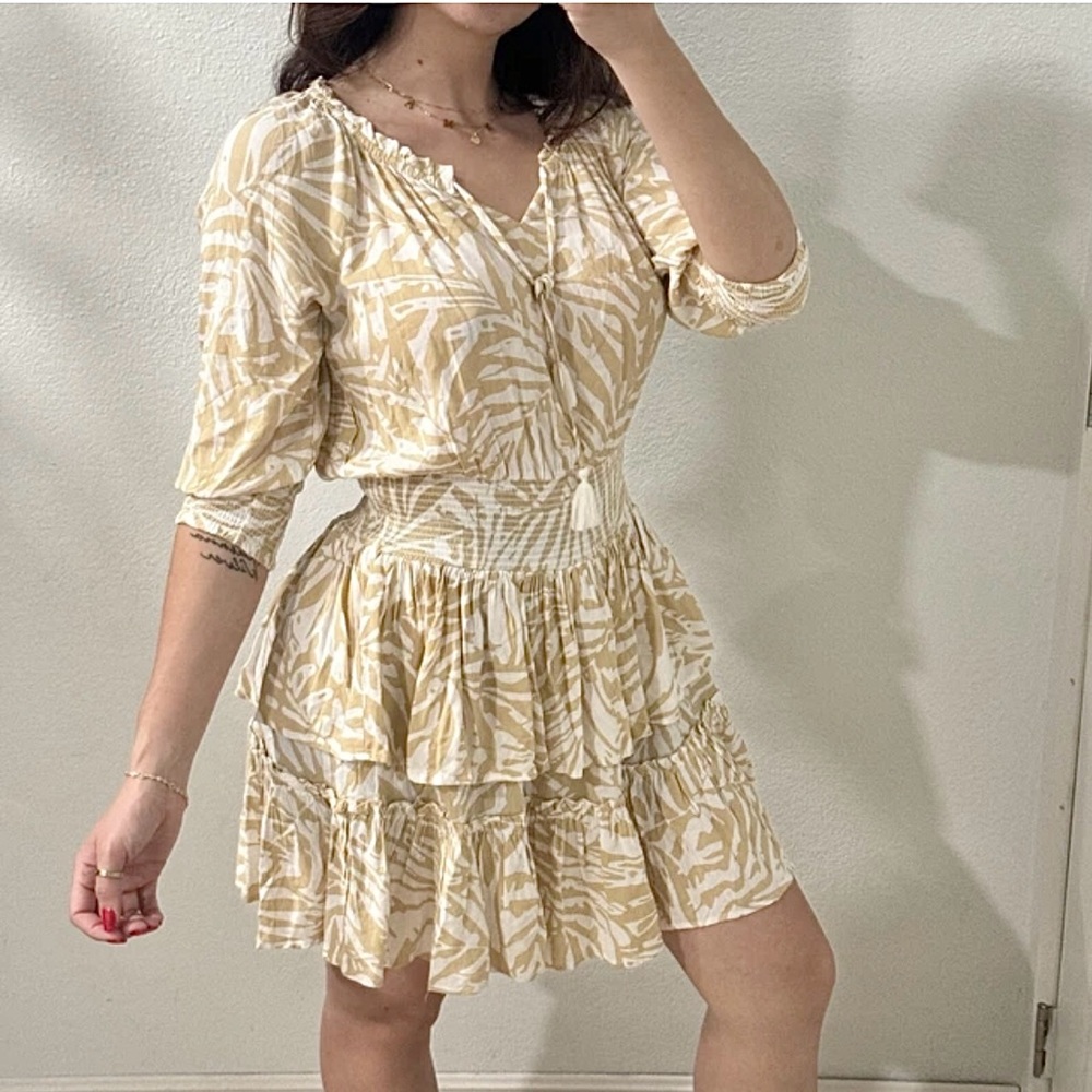 Patrons of Peace June Print Dress
Ruffle Tiered 3/4 sleeves beige and whβ¦